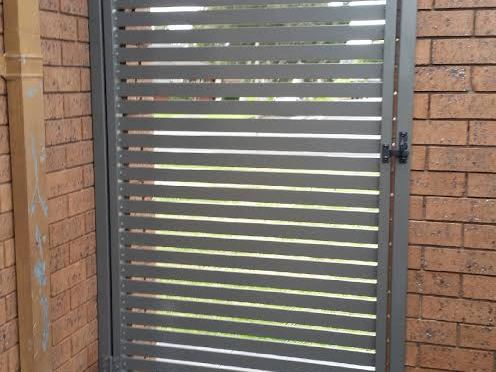 Aluminium slat gate we installed – laser cut faces are built on the same gate frames